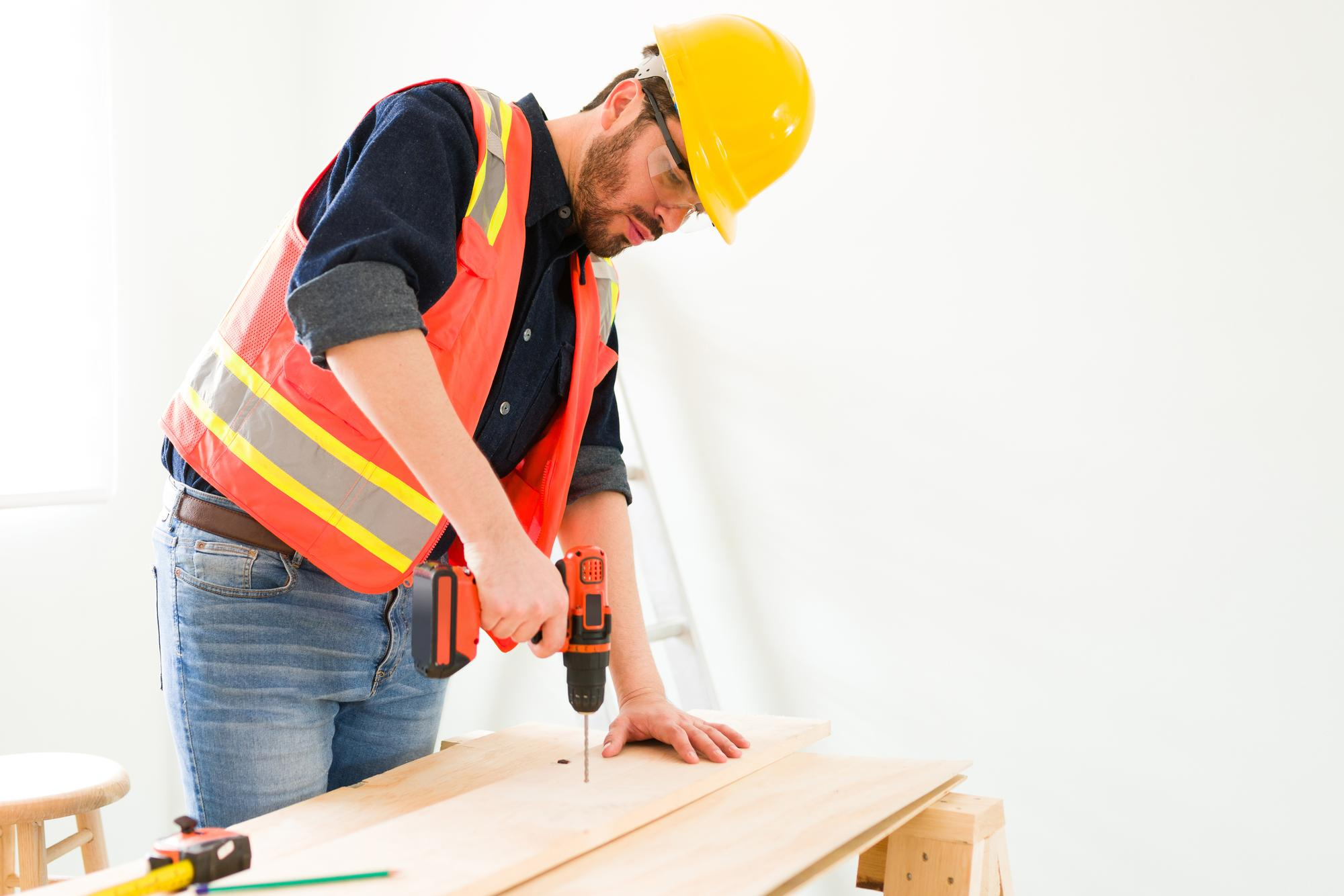 man Drilling in the wood