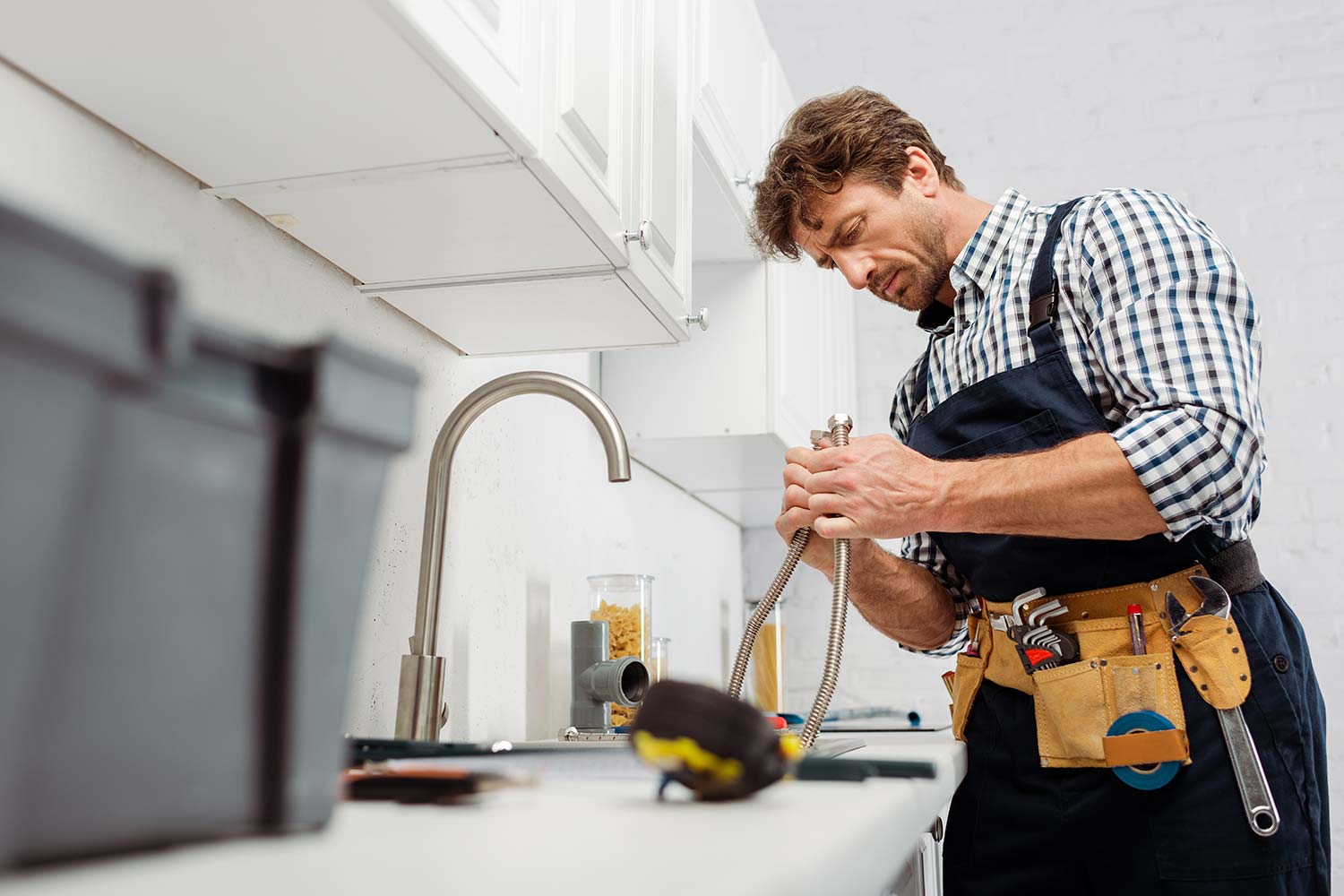 A man doing work of plumbing