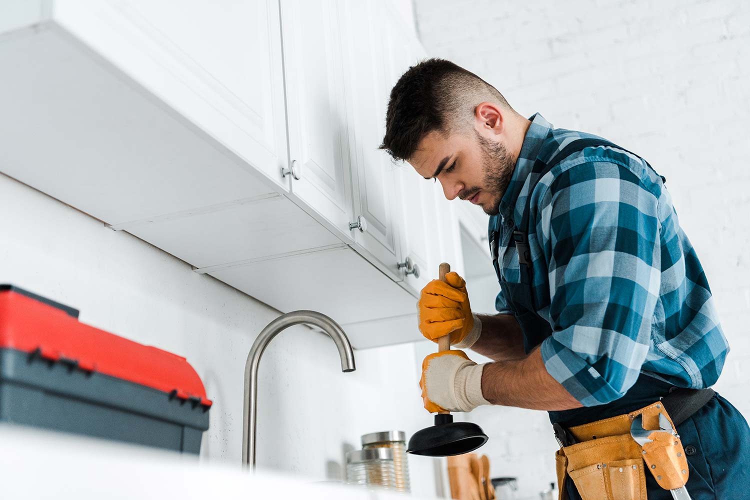man doing the work of plumbing